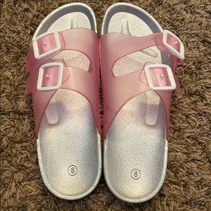 Slip on sandals.